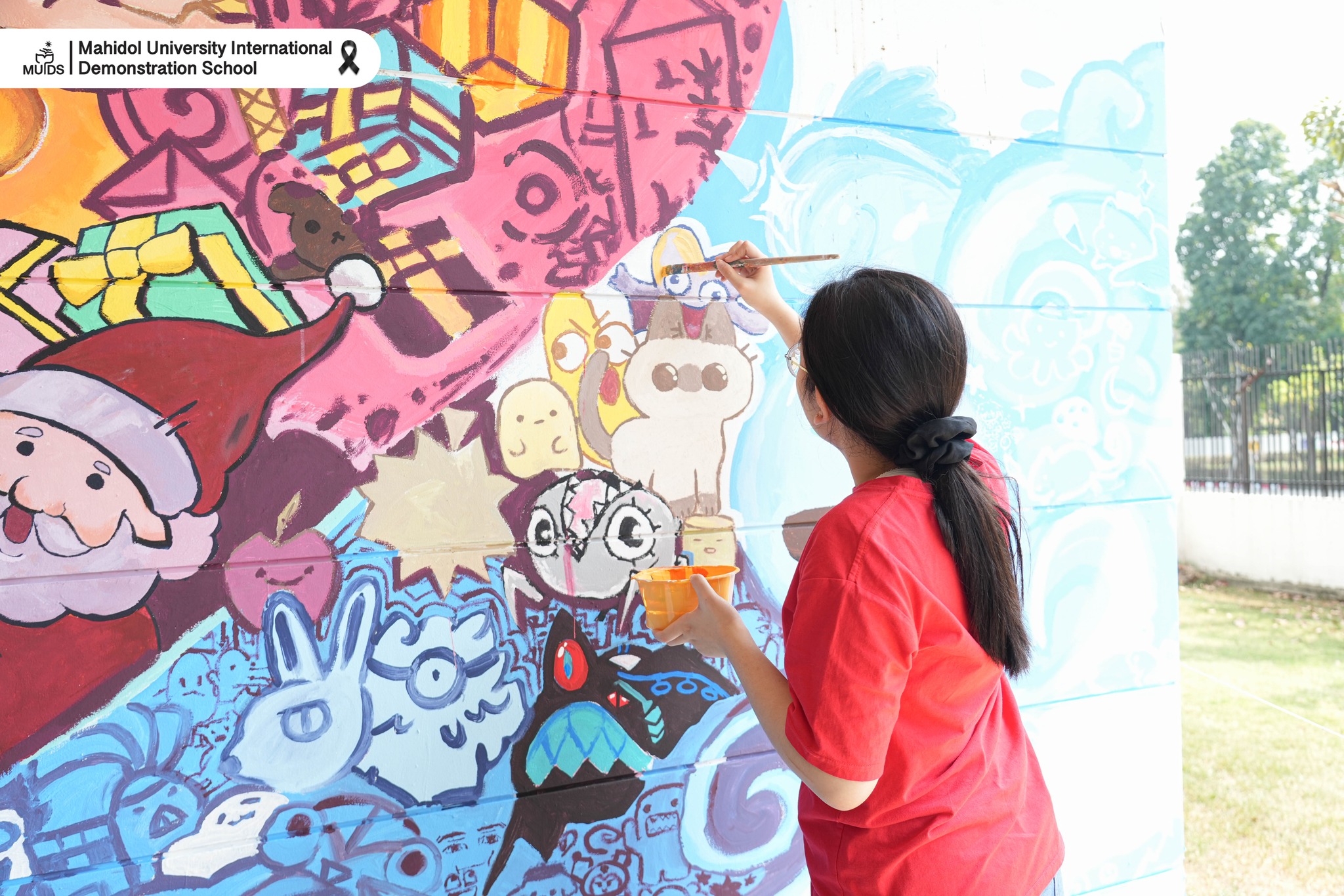 Students creating the mural